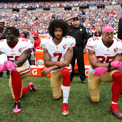 Colin Kaepernick, San Francisco 49ers QB, Sits Out National Anthem